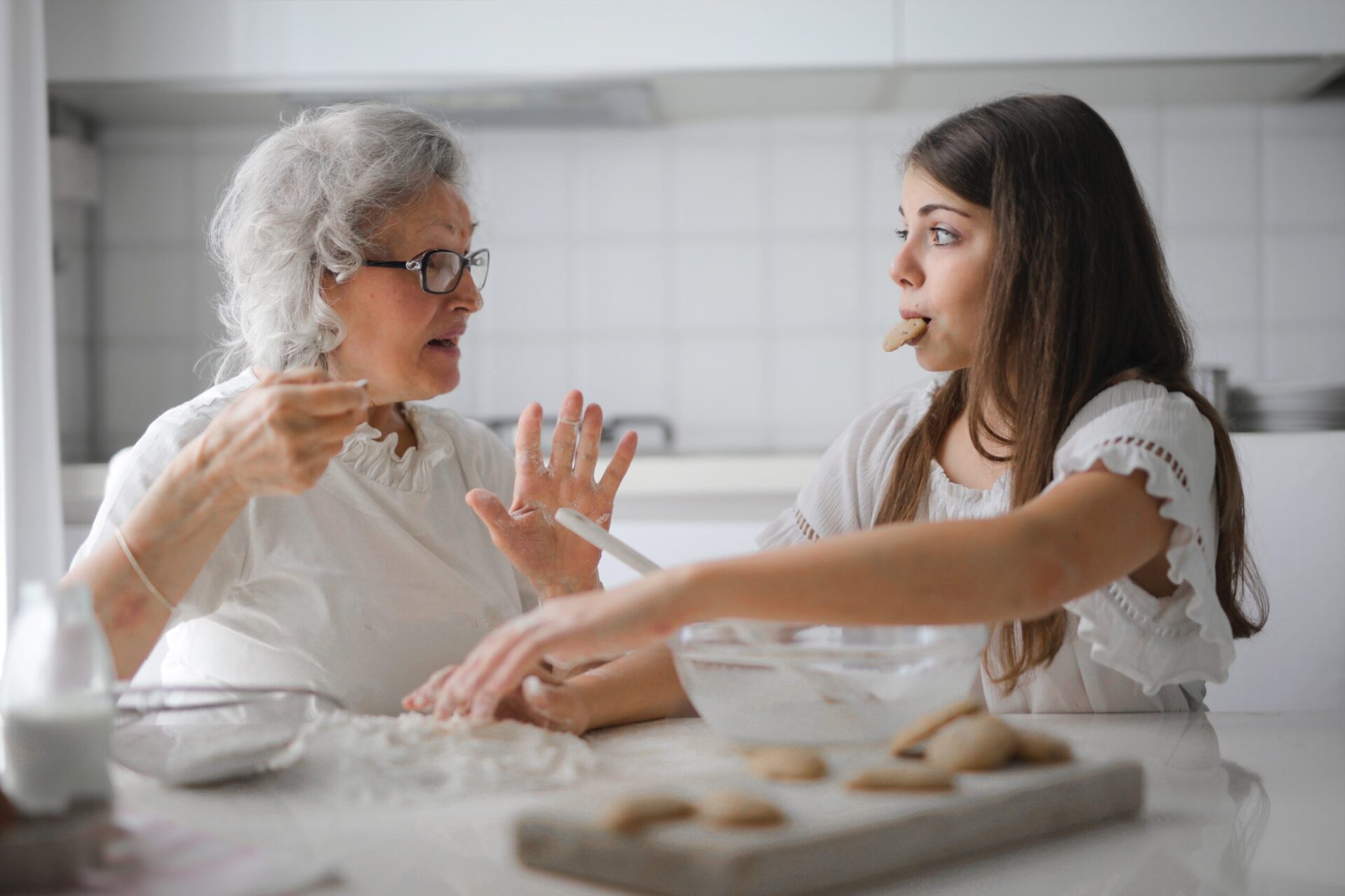 pexels-andrea-piacquadio-3768146 two women baking and eating cookies